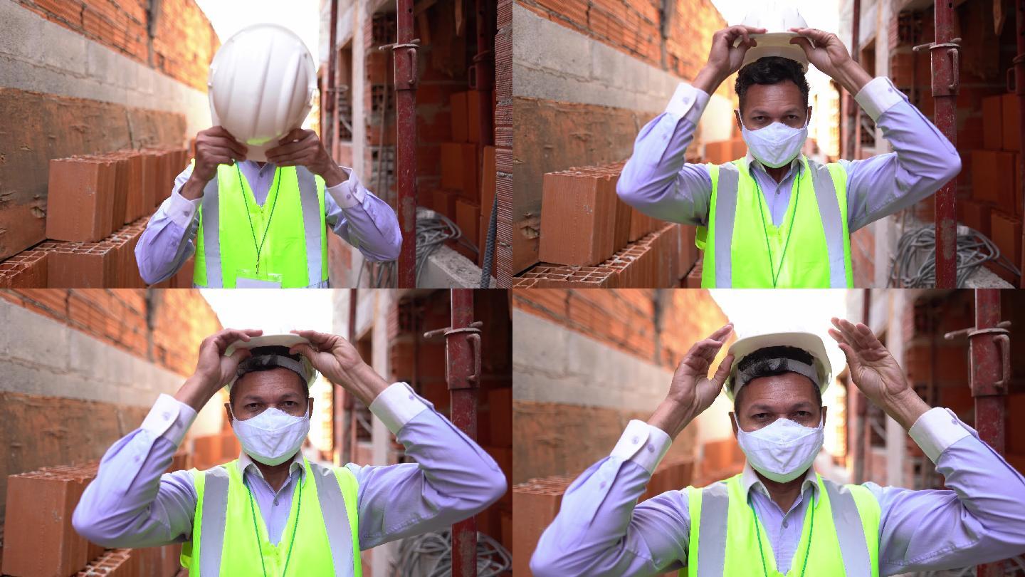 在施工现场使用防护面罩的工程师或建筑师肖像