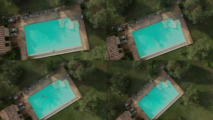 在田园诗般的度假别墅里，一名空中女子跳入游泳池