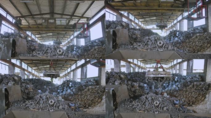 CS废料磁铁在铸造厂的一堆废料上释放废金属