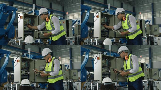 现代工厂自动化生产线质量控制中4K男女工程师检查机械臂运动