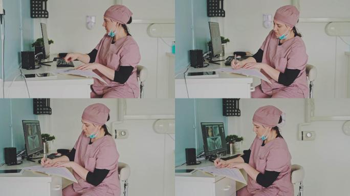 一名年轻女子在牙医办公室工作时使用电脑的4k视频片段