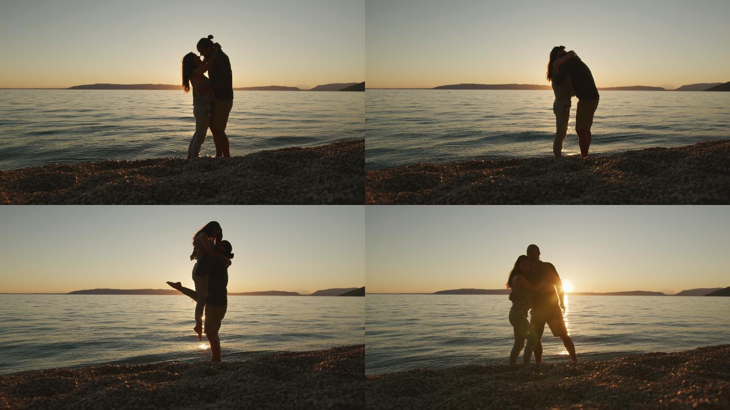 年轻情侣在海滩拥抱浪漫