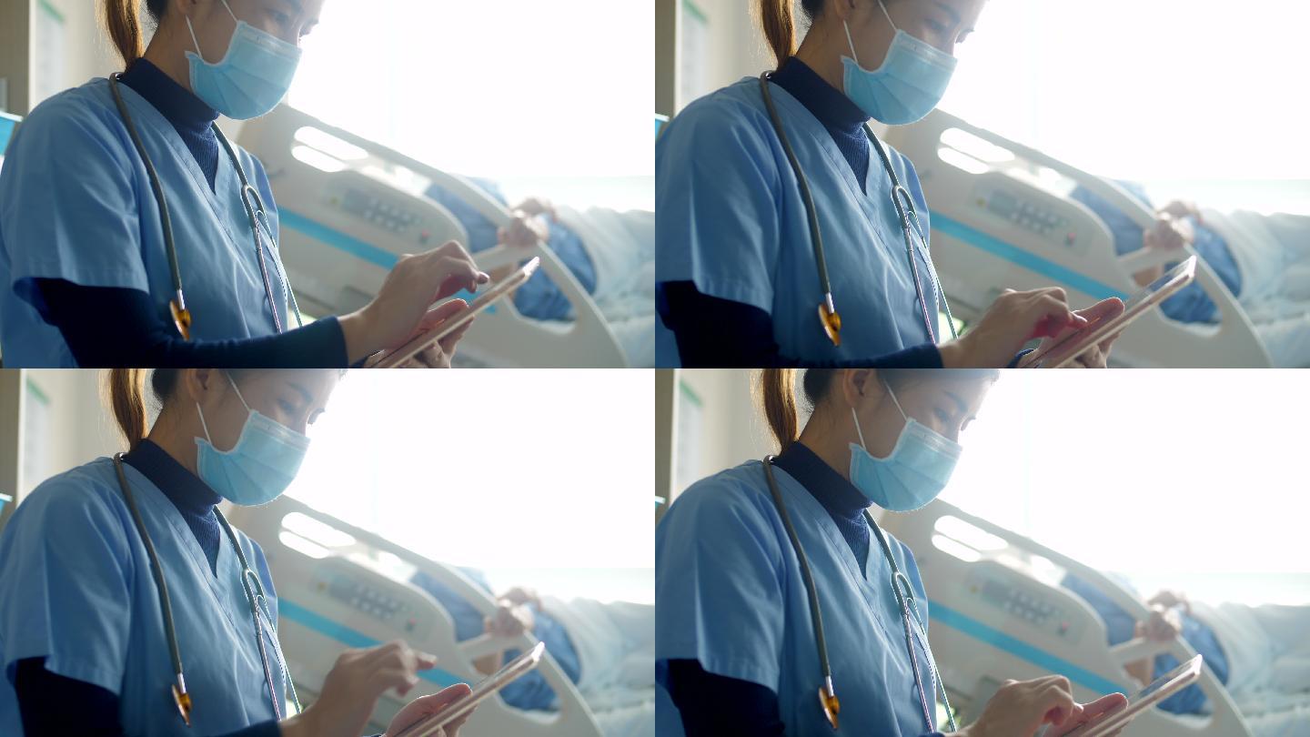 戴口罩的护士检查病人的静脉输液袋