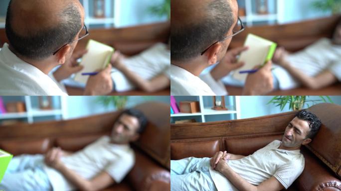 成年男子在接受治疗时躺在精神病医生沙发上的慢镜头视频