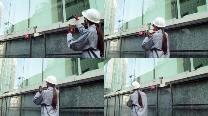 亚洲女技师检查员检查电源箱中的电力。安全女性措施公共
