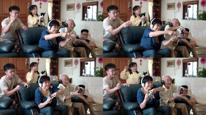 2名亚裔中国祖父母与孙子孙女在家玩电子游戏。