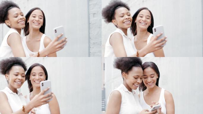 两名年轻女性使用智能手机在户外自拍的4k视频片段