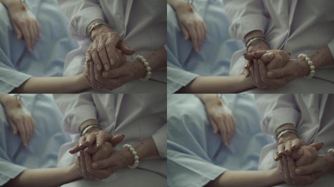 医生握住病人的手，鼓励病人，咨询病人。