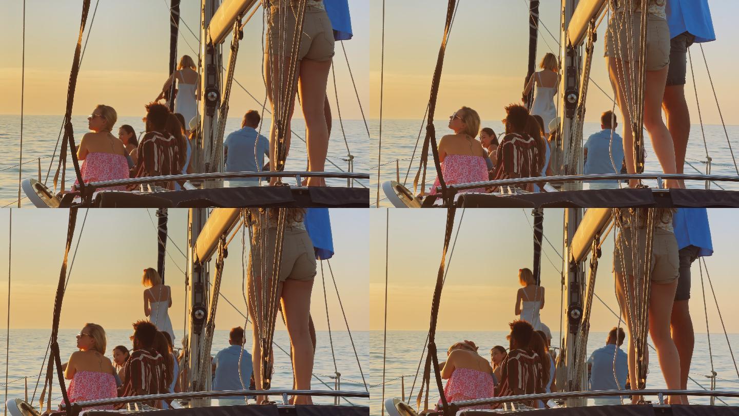 一群年轻人在游艇上欣赏日落