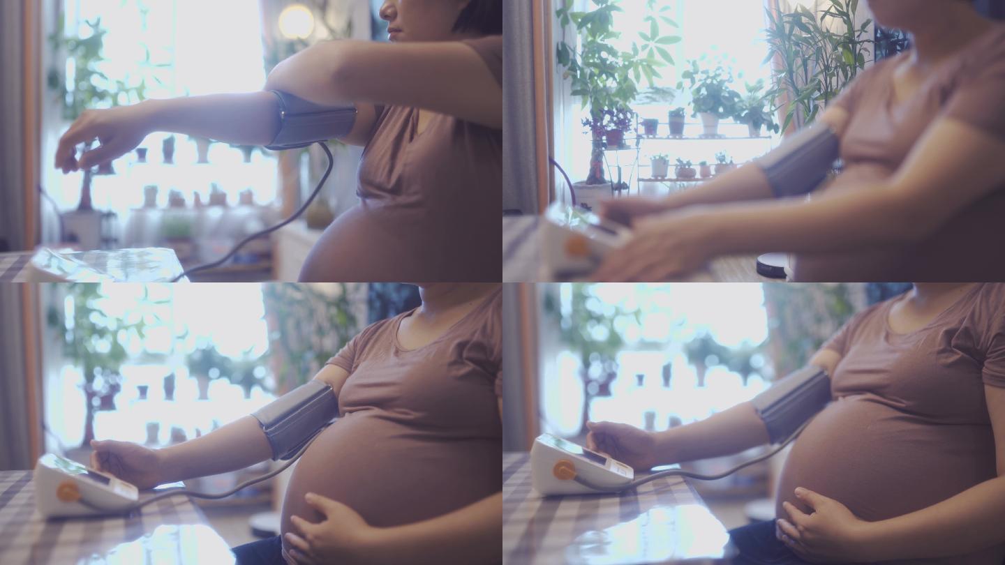 孕妇正在量血压孕妇客厅自动量压器