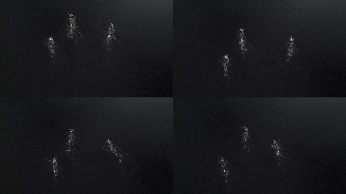 在苏格兰湖中游泳的公开水域游泳者的无人机视图