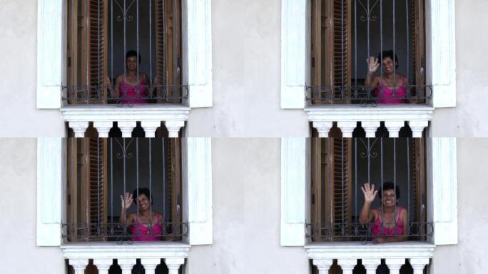 哈瓦那，祖母在典型的窗口挥手
