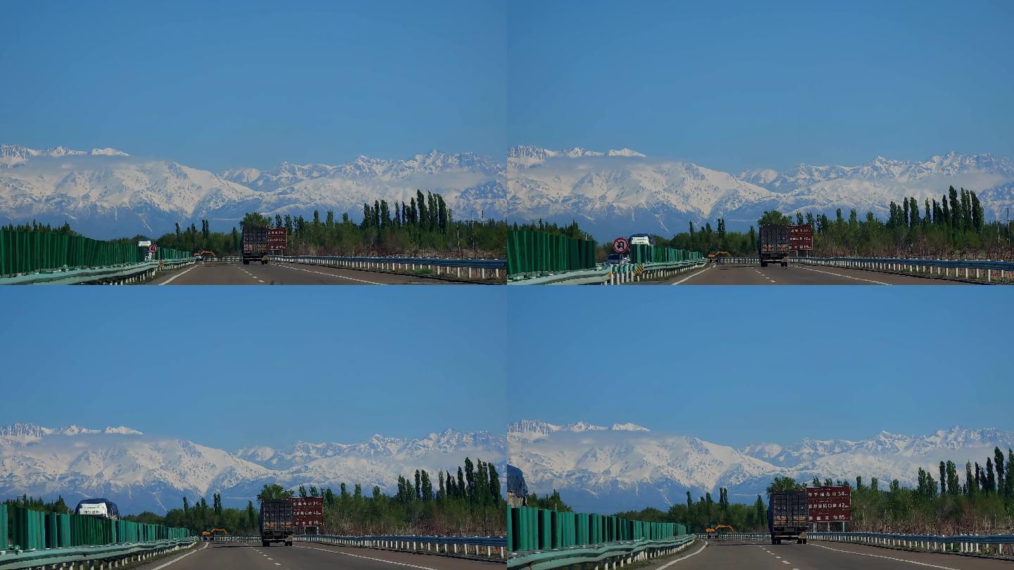 新疆伊犁雪山下的高速公路