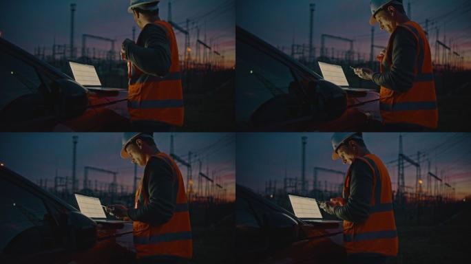 自信的男工程师在电站前使用笔记本电脑