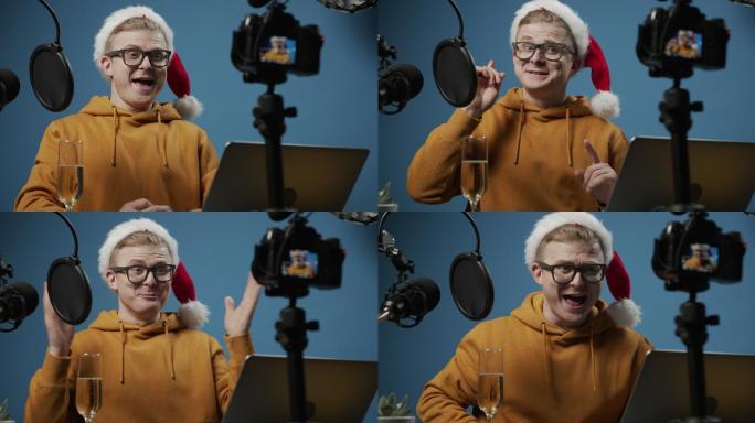 一段背景特写视频，一位年轻迷人的视频博主戴着圣诞帽，一边喝着香槟，一边愉快地谈论假期，