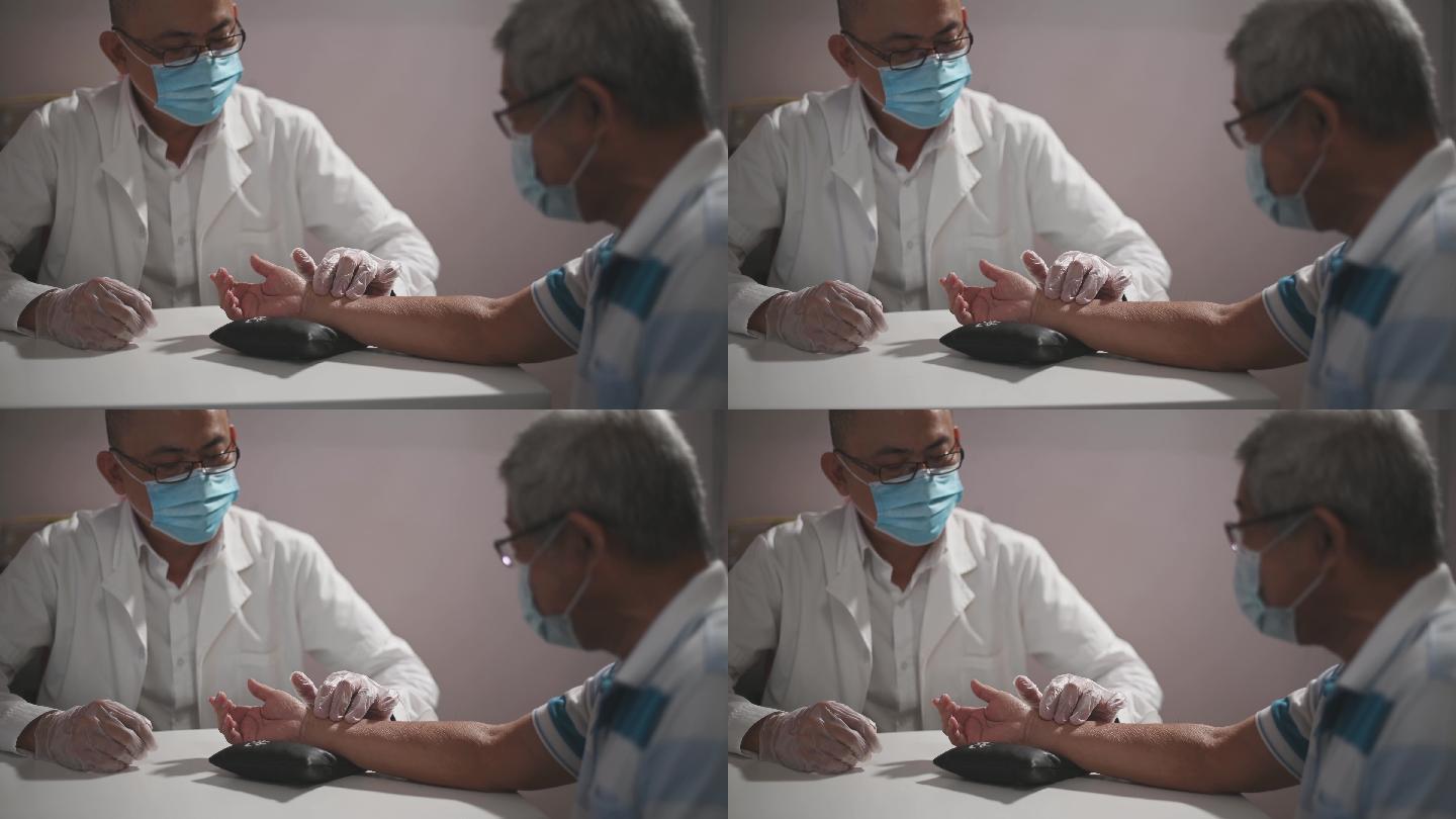 另类治疗师亚裔中国男医生握着老年患者的腕部取脉诊断