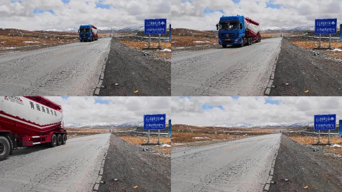 青藏公路昆仑山口运输物资的货车