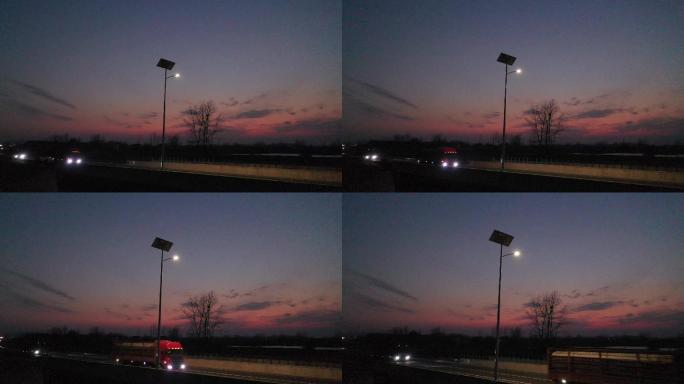 黄昏下路边太阳能路灯绿色电源