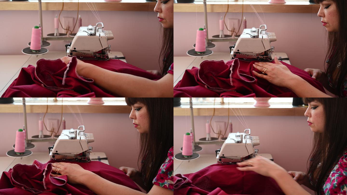 女服装设计师在工作室使用缝纫机