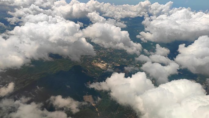 飞机窗外的云景山川河流田园风光