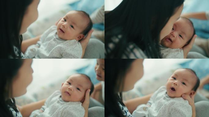 亚洲母亲抱着可爱的男婴
