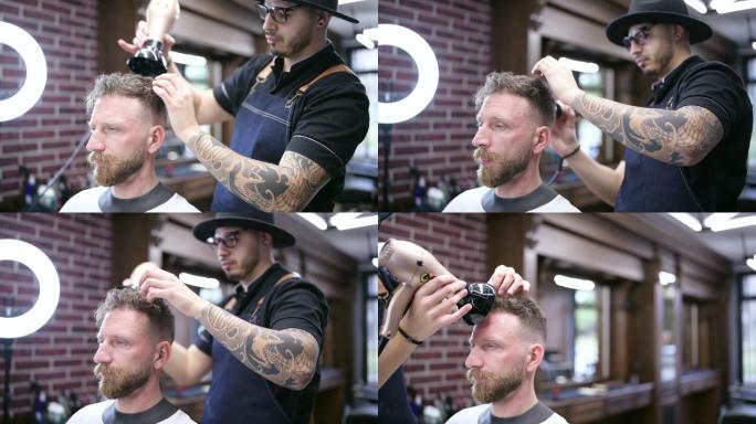 理发师整理客户的发型。