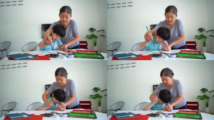 亚洲男孩向祖母学习中国书法