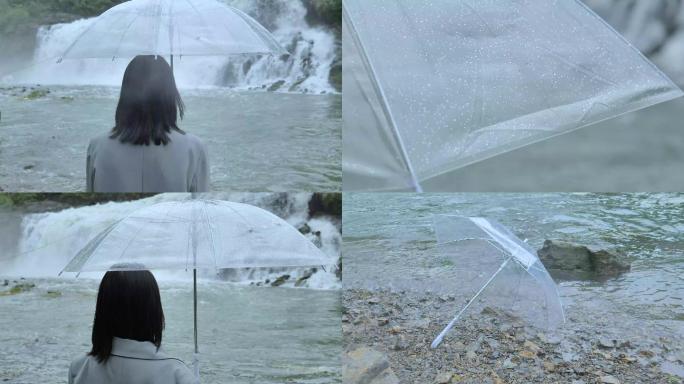 忧伤的文艺女孩打伞在水边