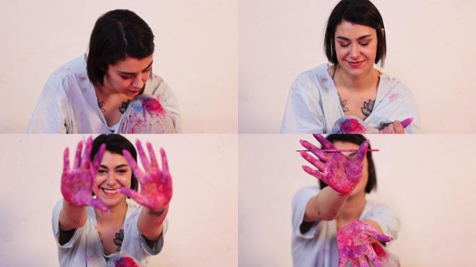 富有创造力的女艺术家展示了她沾满紫色颜料的脏手