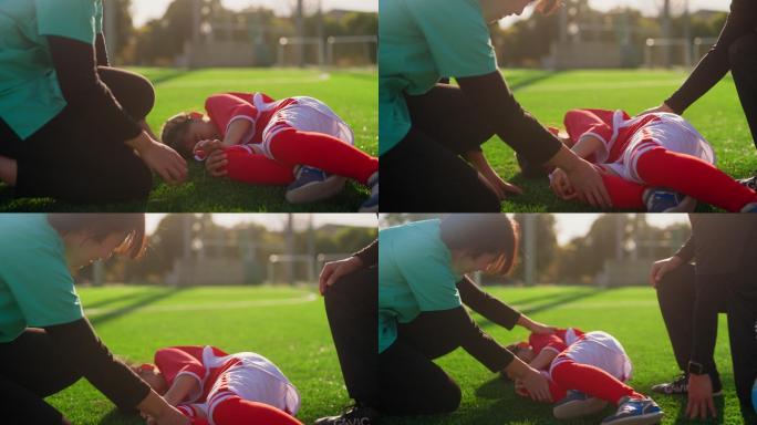 护士检查女性初级足球运动员或足球运动员的受伤情况