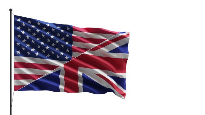 4k美国和英国国旗在桅杆上迎风飘扬的概念