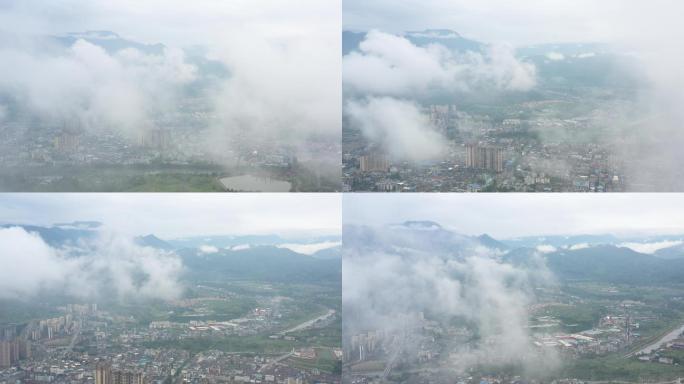 航拍穿越云雾中的茶马古道城镇