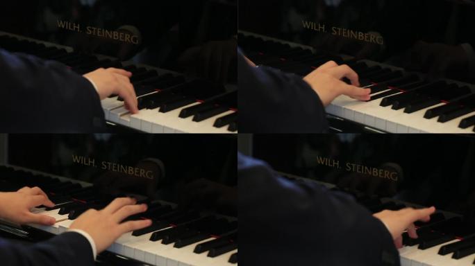 年轻男孩演奏钢琴曲手弹钢琴特写原素材