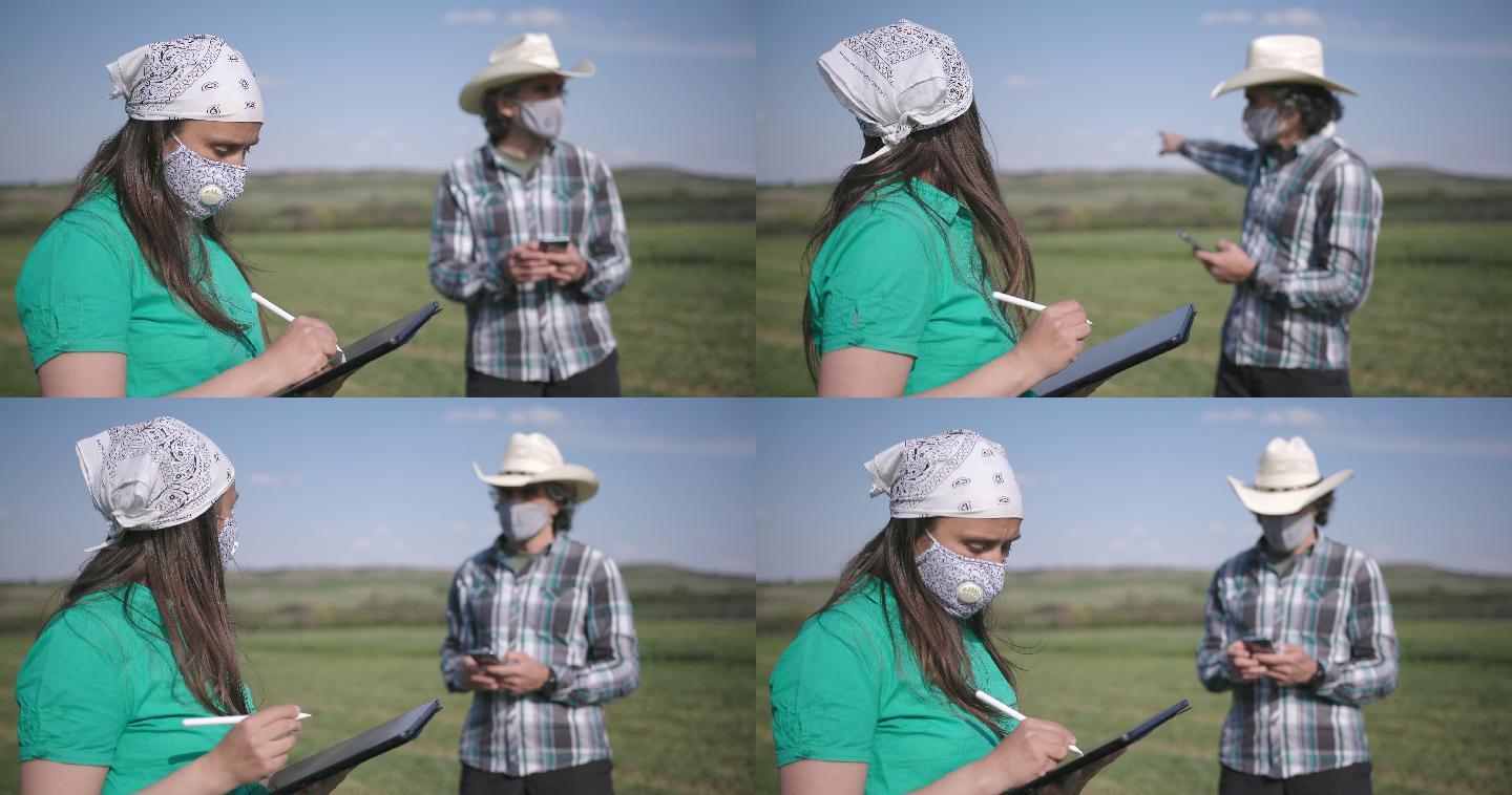 在2019冠状病毒疾病大流行期间，农民操作遥控拖拉机割草苜蓿。智慧农业。