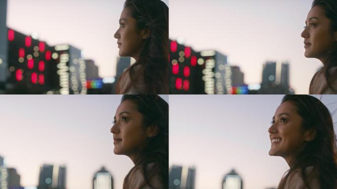 一名女子夜间在城市屋顶上的4k视频片段