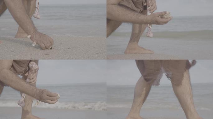 原始人在海滩上捡贝壳