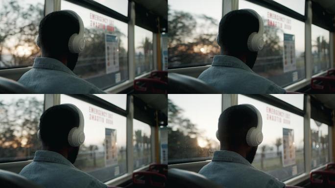 一名无法辨认的男子在公交车上使用耳机的4k视频片段