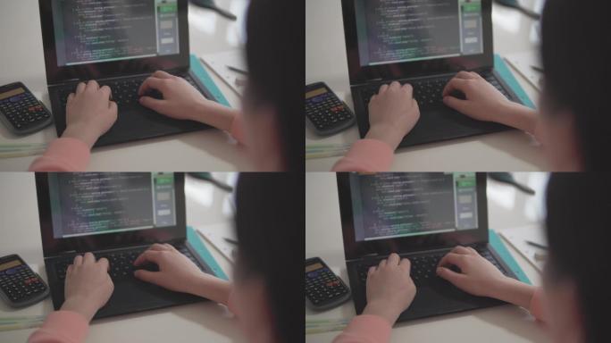 女孩在家学习笔记本电脑编码的视角