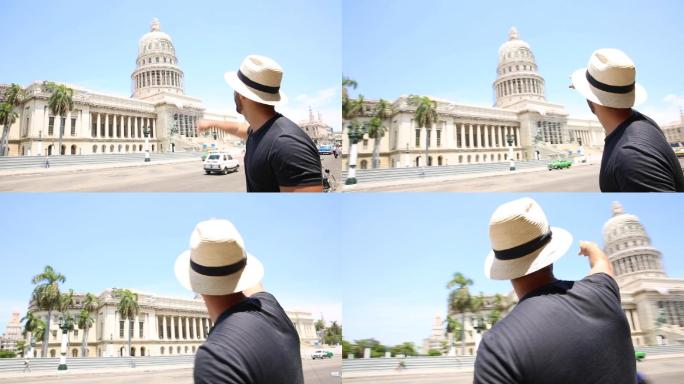 古巴，欣赏哈瓦那建筑的游客