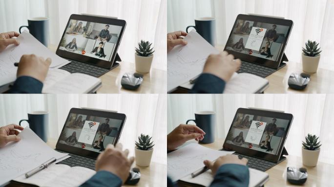 商人在家工作时在数字平板电脑上进行视频会议时失去了网络