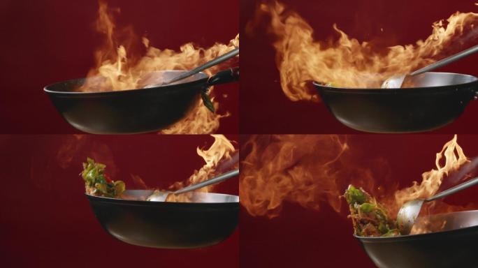菜在有火焰的锅中翻炒