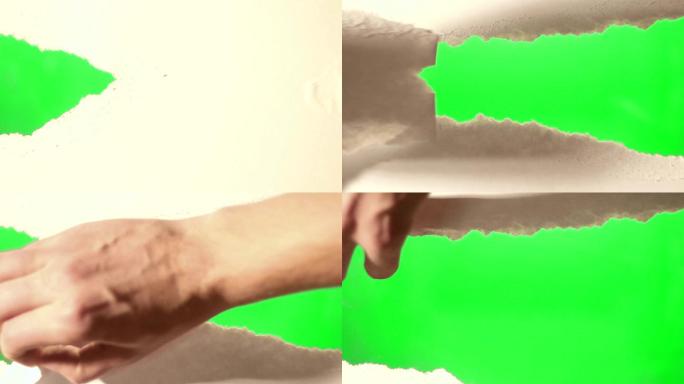 用手在屏幕上撕纸，露出绿色屏幕
