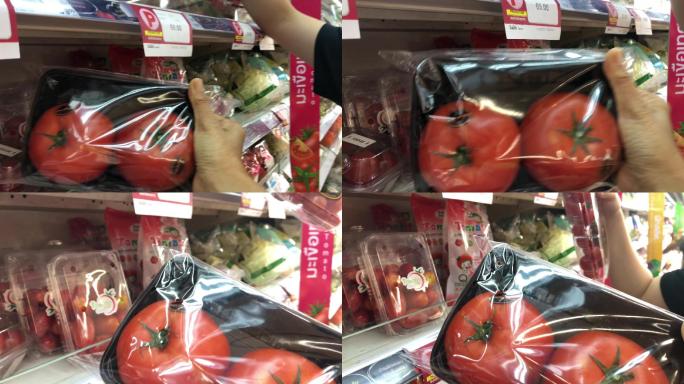 超市女性手工购物新鲜有机食品，西红柿