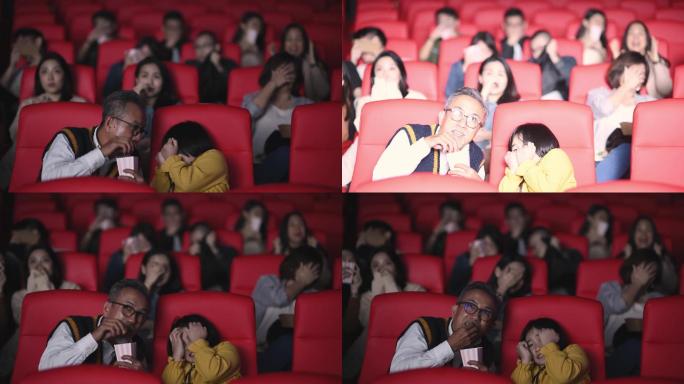 亚洲华人活跃老人和孙女在电影院看恐怖恐怖惊悚片