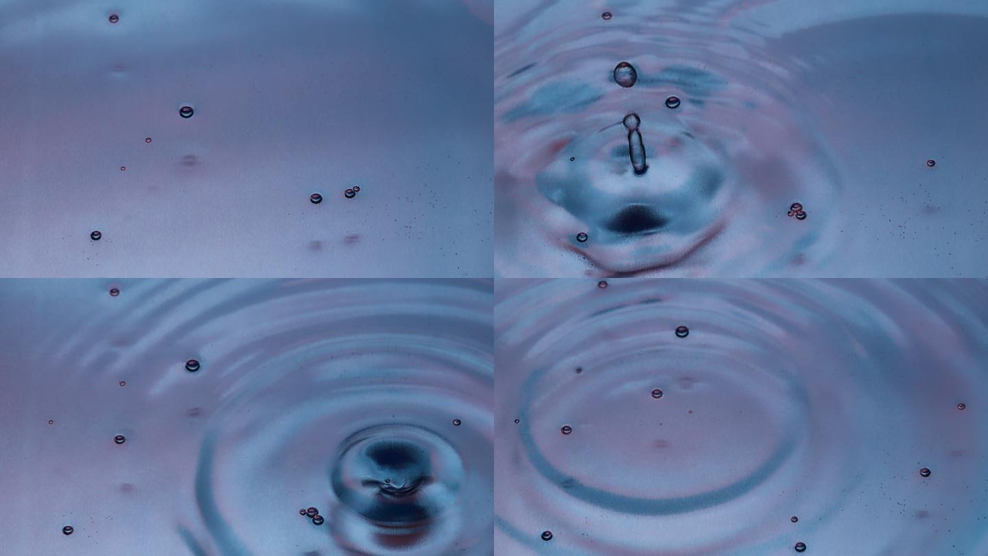 水滴慢动作溅落水面的特写镜头