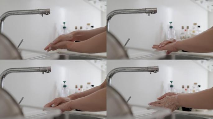女性洗手以防止冠状病毒传播的特写镜头