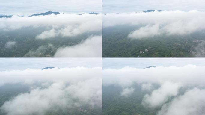 航拍穿越云雾中的青山