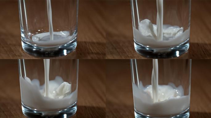 SLO MO将牛奶倒入玻璃杯中