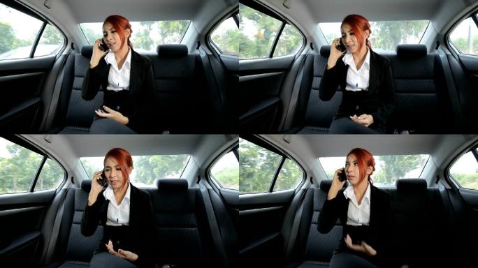 愤怒的亚洲女商人后排座椅行驶中的车辆网约
