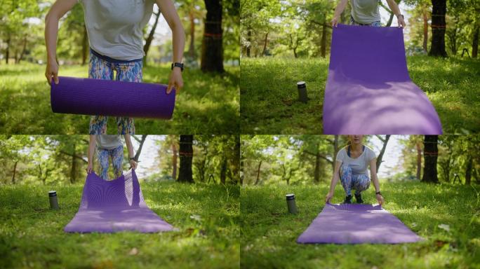 女子在天然草地上铺运动垫进行运动训练的慢动作视频剪辑